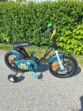 Otroško kolo Btwin 14 s pomožnimi kolesi